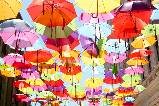 Timisoara, Romania - May 30, 2015: The Alba Iulia street decorated with colorful umbrellas over the blue sky
