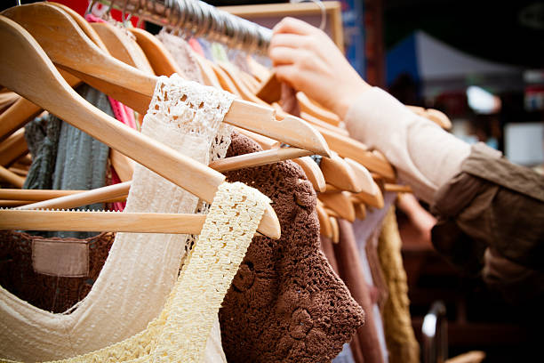 Rack of dresses at market stock photo