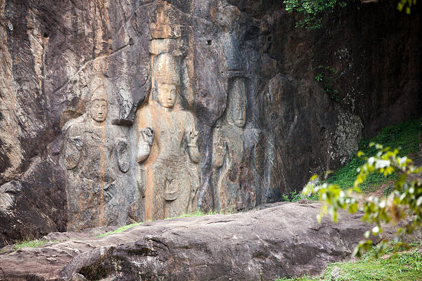 istock Buddha statues carved in rock at Buduruvagala temple 512623094