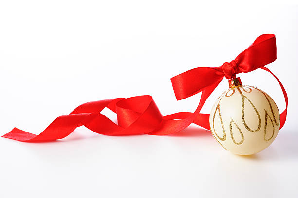 istock White Christmas ball with red ribbon on white background 512623147