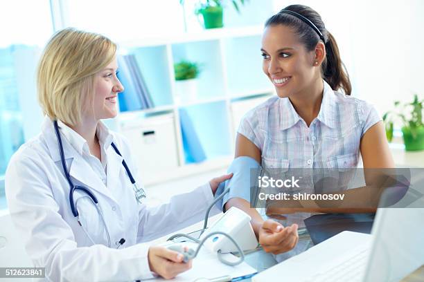 Measuring Blood Pressure Stock Photo - Download Image Now - Adult, Assistant, Care