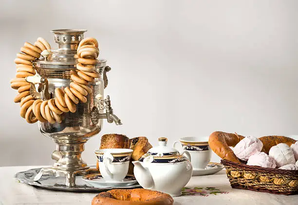 Tea setting with samovar, bagels bread and scones