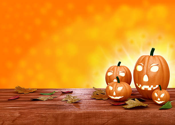 istock Halloween pumpkin lanterns on orange background 512626371
