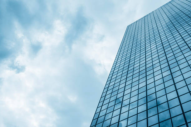 istock Clouds reflected in glass skyscraper in Brussels, Belgium 512626535