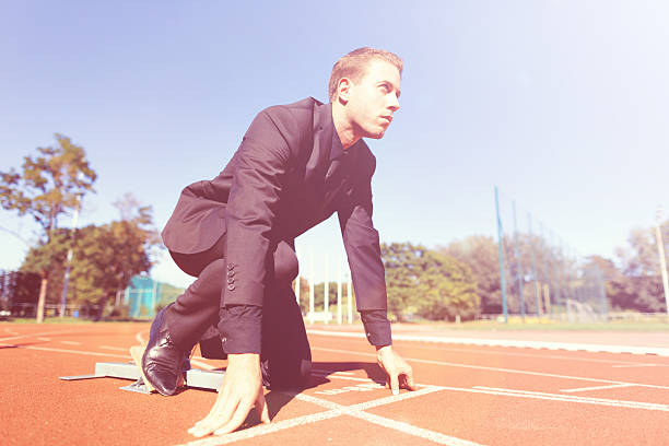 istock focused businessman in starting block 512626969