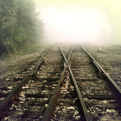 Railroad tracks heading into fog.  Photographed with an iPhone.