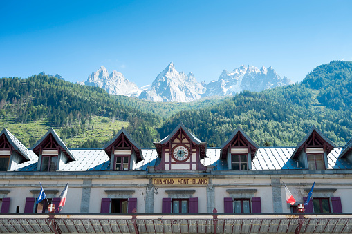 Chamonix, France - September 2, 2014: Facade of Chamonix train station, with Mont Blanc in the background. The city is one of the stages in the popular Mont Blanc tour.