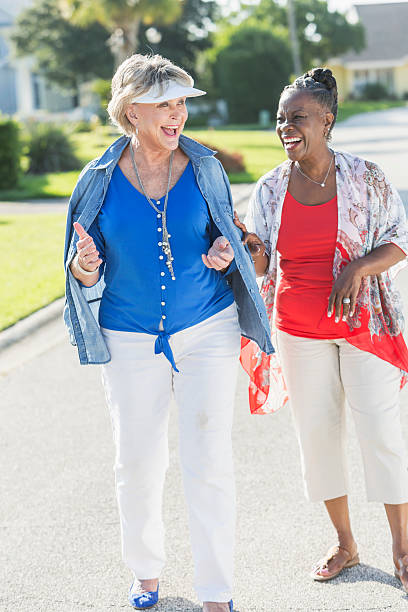 istock Senior women taking a walk on a sunny day, laughing 512628132
