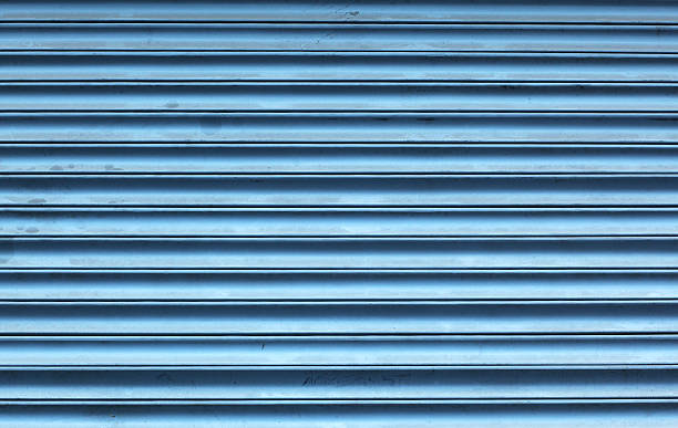 istock Dark teal painted steel door background 512629244