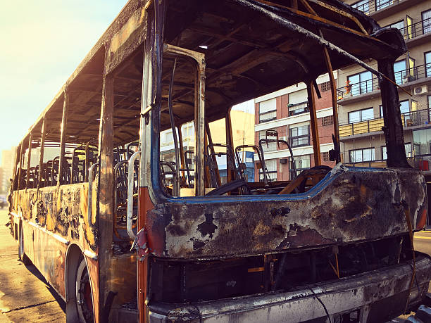 istock Burnt bus in the street 512629516