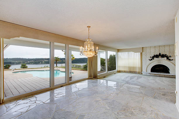 istock Large luxury empty living room with white marble floor. 512631362