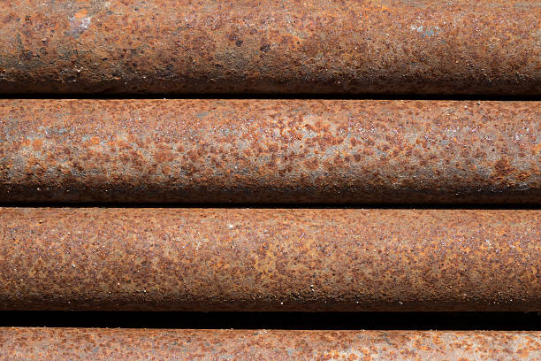 Close Up Photo Of Rusty Metal Pipes In A Row stock photo