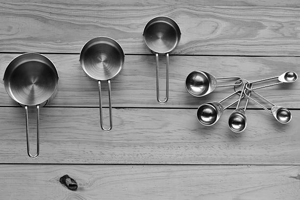 Flat Lay Of Stainless Steel Measuring Cups And Spoons Stock Photo -  Download Image Now - iStock