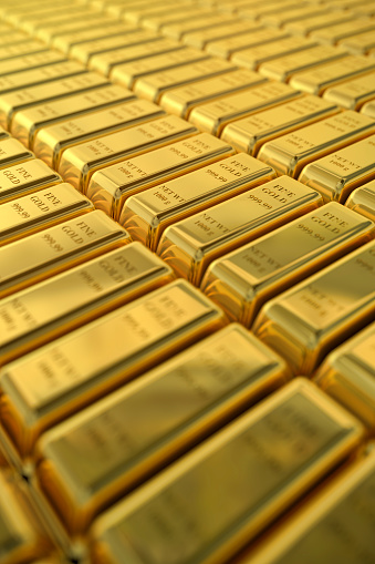 A large pile of Fine Gold 999.99 NET WT 1000g bars vertical background.  Please see my portfolio for 3D renders and images. 