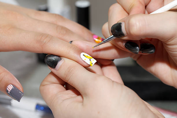 istock manicure process, gel nail, close-up, 512638626
