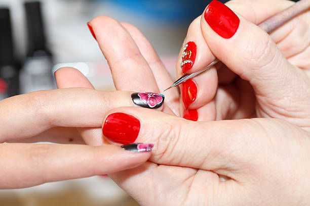 istock manicure process, gel nail, close-up, 512639566