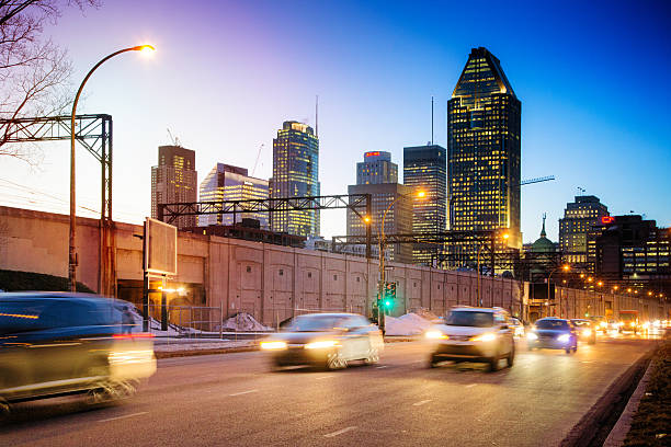 istock Downtown Montreal skyline at night with incoming traffic 512639774
