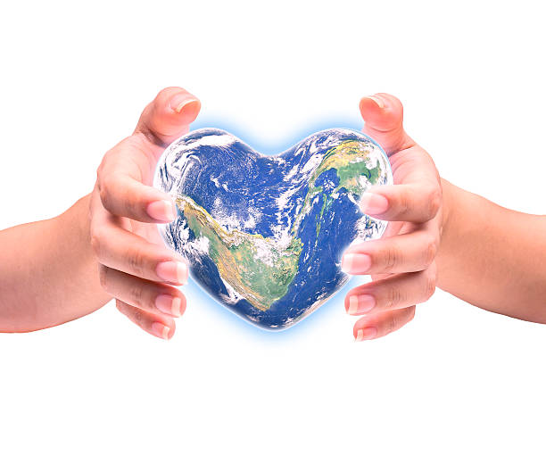 istock Blue planet in heart shape over woman human hands 512640978
