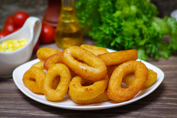 istock deep fried calamari with sauce and salad 512681408