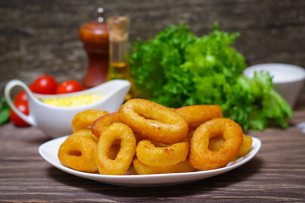 istock deep fried calamari with sauce and salad 512681438
