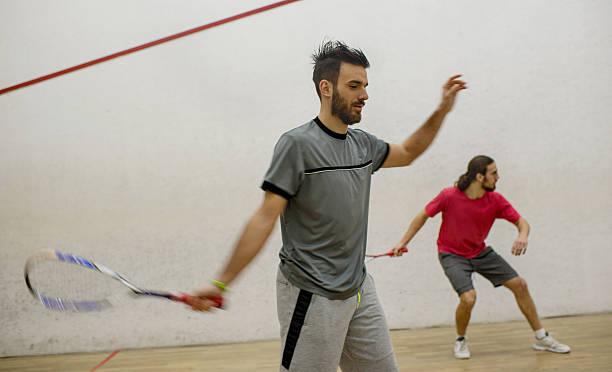 istock Young men exercising squash on a court. 512685572