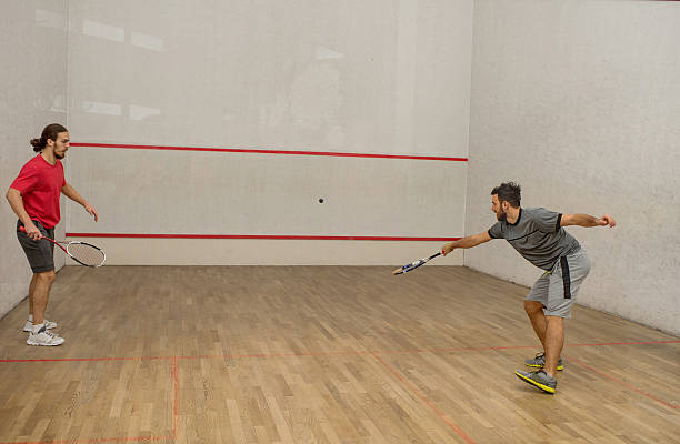 istock Male athletes playing squash on a court. 512685728