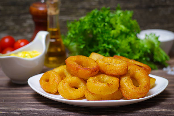 istock deep fried calamari with sauce and salad 512686186
