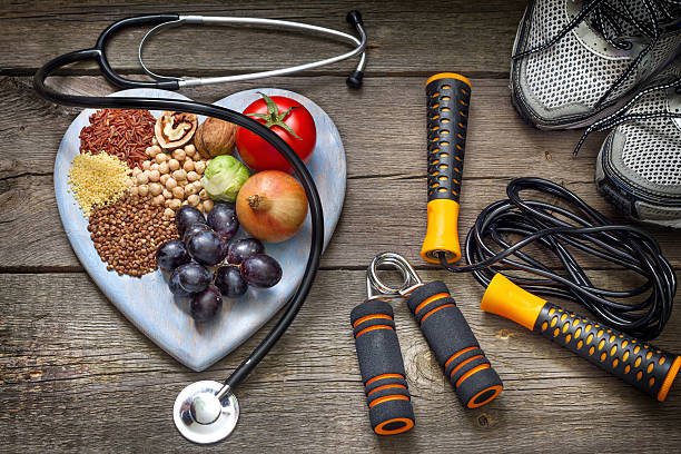 Healthy lifestyle concept with diet and fitness Healthy lifestyle concept with diet and fitness on wooden boards healthy diet and exercise stock pictures, royalty-free photos & images
