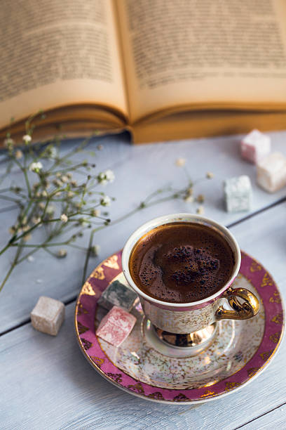istock Cup of Turkish coffee with Turkish delights and old book 512686862