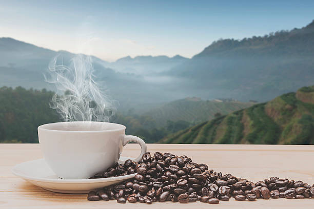istock Coffee on wooden table with  Morning Rice fields 512687750