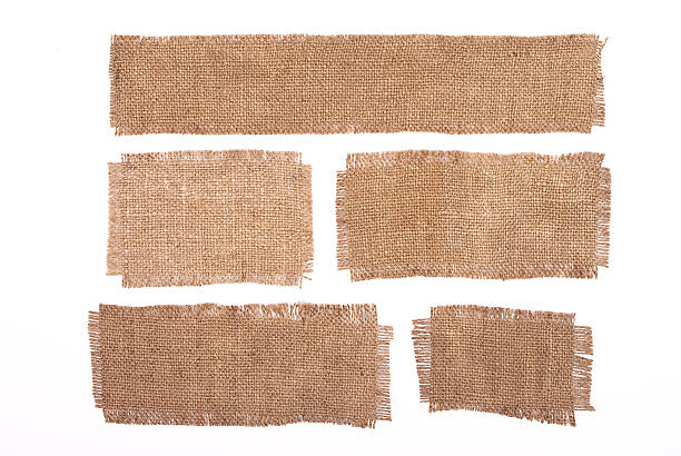 materiali tela di sacco sola su bianco - sackcloth burlap canvas textile foto e immagini stock
