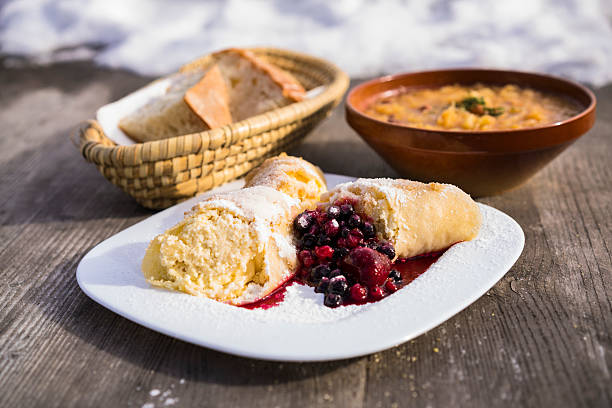 Dumplings, bread and stew on  plateau Velika Planina