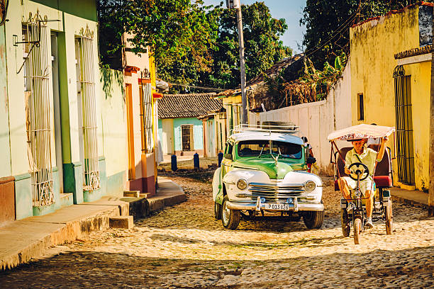 August 8, 2018 - Trinidad, Cuba: Vintage car in the middle of the street in the old town of Trinidad, Cuba