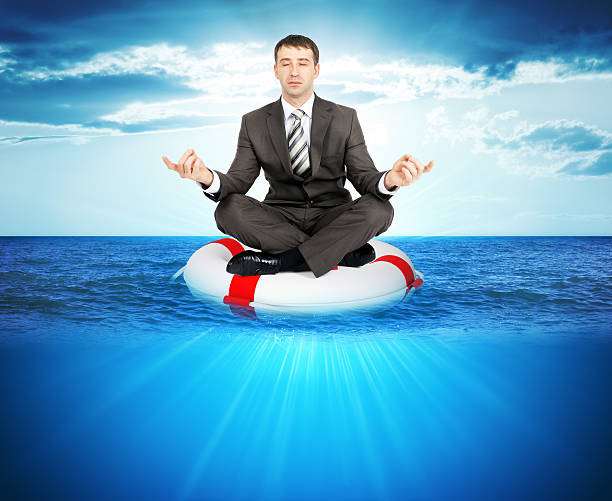 istock Buisnessman on lifebuoy 512690926