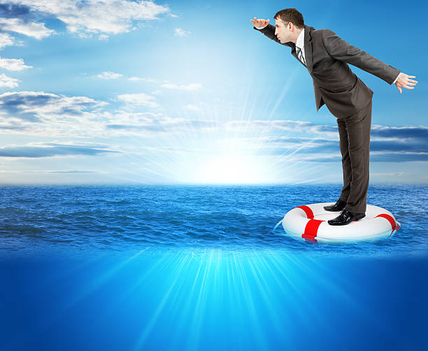 istock Buisnessman on lifebuoy 512691040