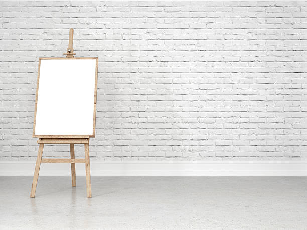 istock Easel with blank canvas in front of the white wall 512691416