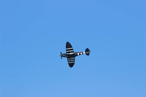 istock Spitfire Plane in the air seen from below 512693947