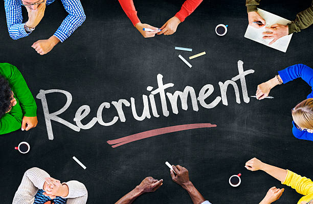 istock Group of Multiethnic People Discussing Recruitment 512694211