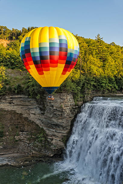 Hot Air Balloon At Letchworth State Park Hot Air Balloon Flying Over The Middle Falls At Letchworth State Park In New York letchworth state park stock pictures, royalty-free photos & images