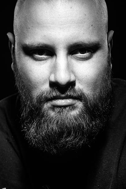 istock Portrait of brutal man with a beard 512695724