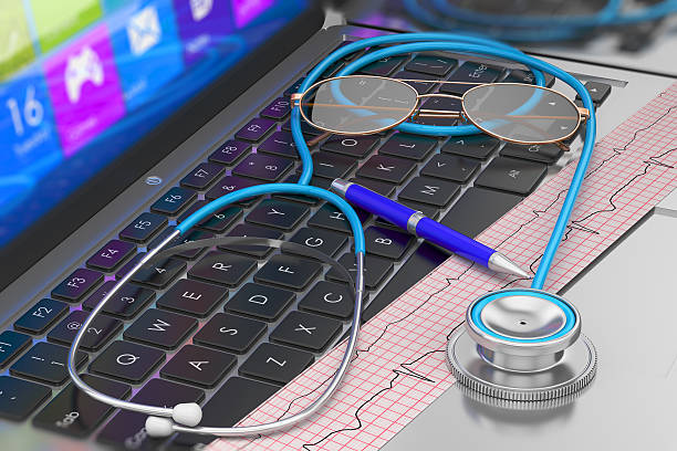 istock Stethoscope and ECG on laptop keyboard 512696046
