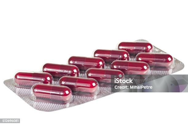 Pack Of Colored Medical Capsules In Blister Stock Photo - Download Image Now - Antibiotic, Assistance, Blister