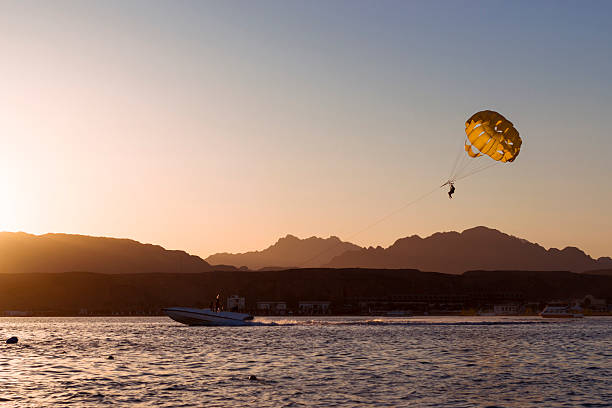 istock Parachuting over a sea, towing by a boat in Sharm 512696508