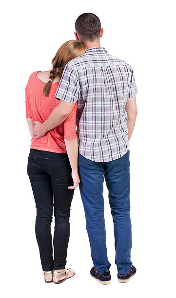 istock Back view of young embracing couple 512696759