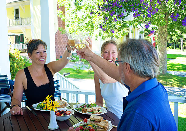 istock Three Adults Dining in Mahone Bay, Nova Scotia. 512697969