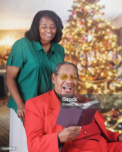 Christmas Bible Read Stock Photo - Download Image Now - Active Seniors, Adult, African Ethnicity