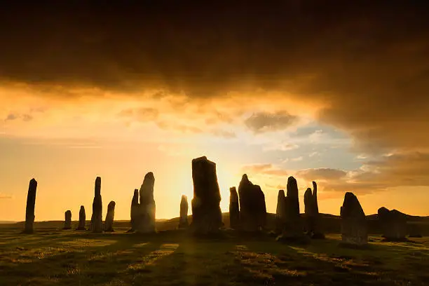 Megalithic stone circle of 3000 bc on the Isle of Lewis and Harris, Outer Hebrides, Scotland, silhouette at sunset