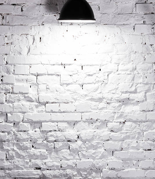 istock texture of brick whitewashed wall with lamp on top 512699016