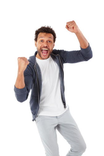 Portrait of happy mature man standing with his hands raised and screaming over white background