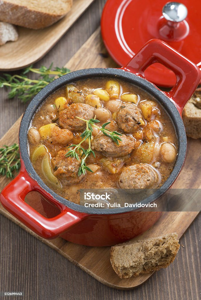 delicious vegetable stew with sausages in a pan, top view delicious vegetable stew with sausages in a pan, top view, vertical Bean Stock Photo